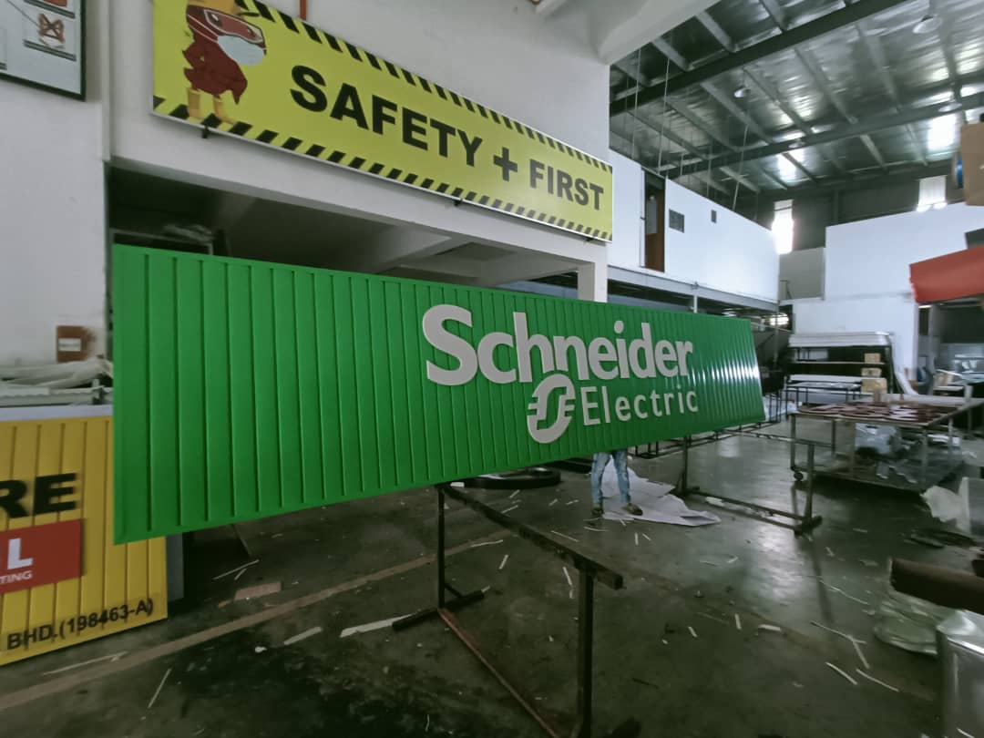 Schneider Electric vertical aluminium strip signboard, fabricated in our workshop