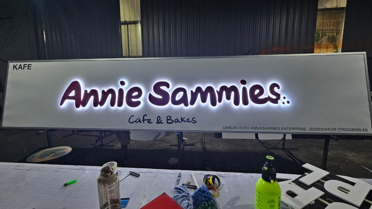Annie Sammies Cafe backlit lightbox signboard with glowing script lettering